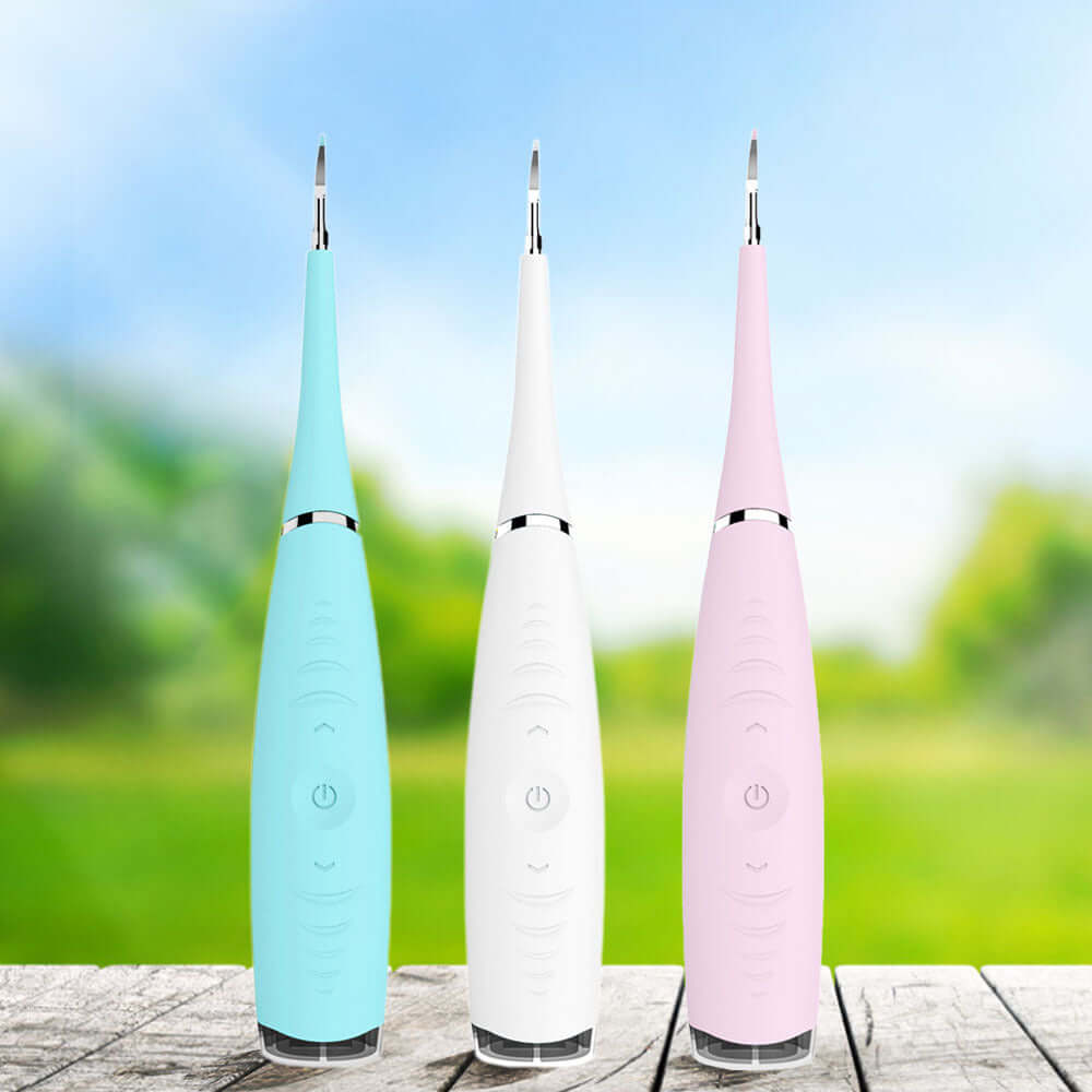 Household Electric Teeth Cleaner Ultrasonic Tartar Dental Calculus Remover Teeth Health Care Device in blue, white, and pink.