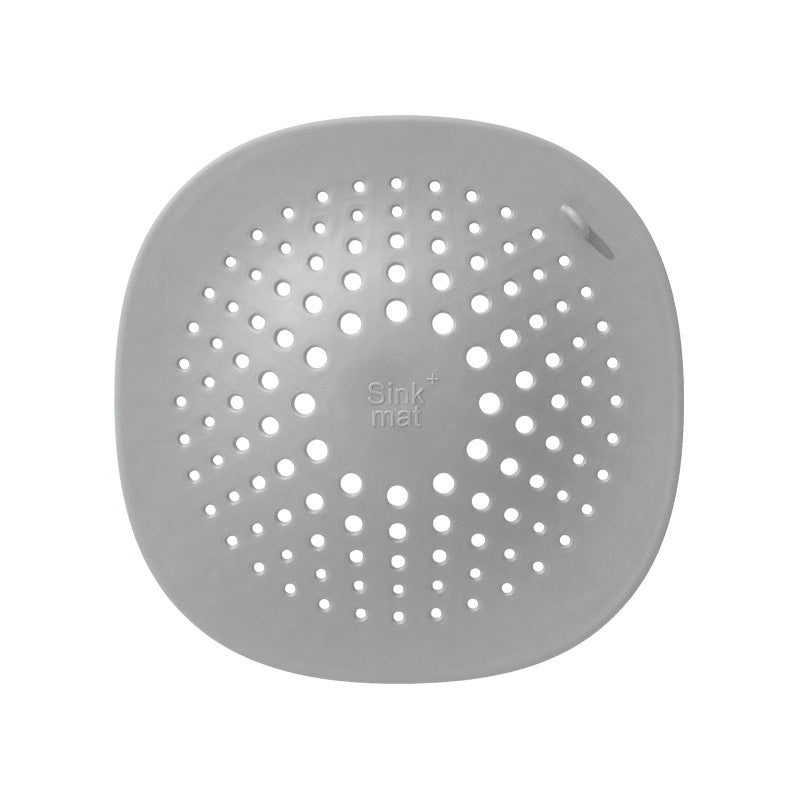 High quality dark grey kitchen sink floor drain with multiple holes for effective drainage.