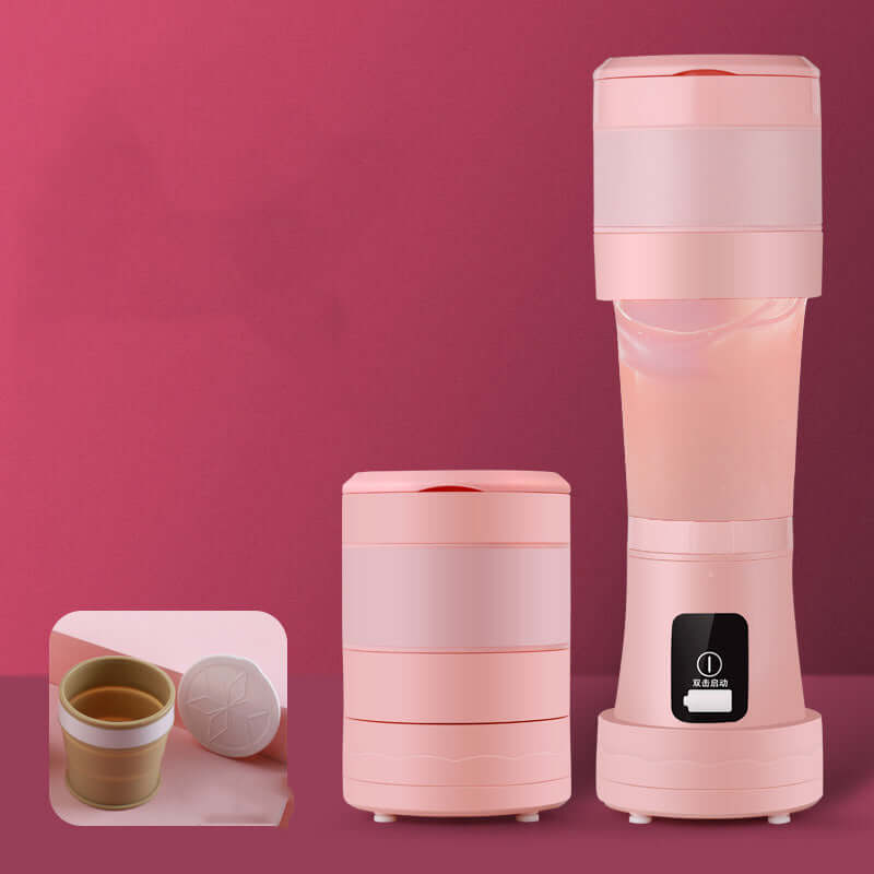 Mini portable blender for smoothies in pink, featuring a compact design and removable cup.