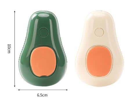 Electric pet grooming brush in green and cream colors with dimensions shown.